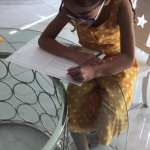 jemima writing her kindness postcard